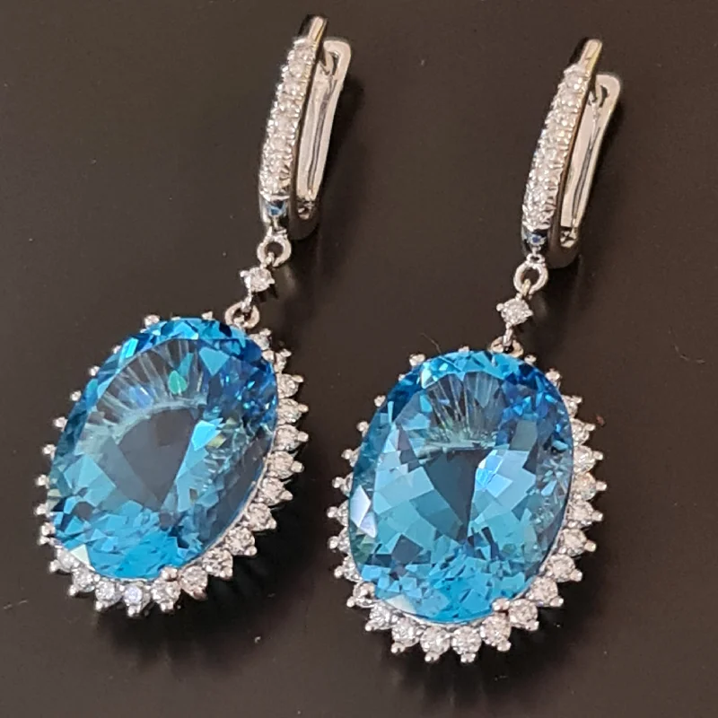 Neta - 21.00 carat oval natural blue topaz earrings with 2.50 carat natural diamonds